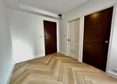 Interior view of a bedroom with wooden doors