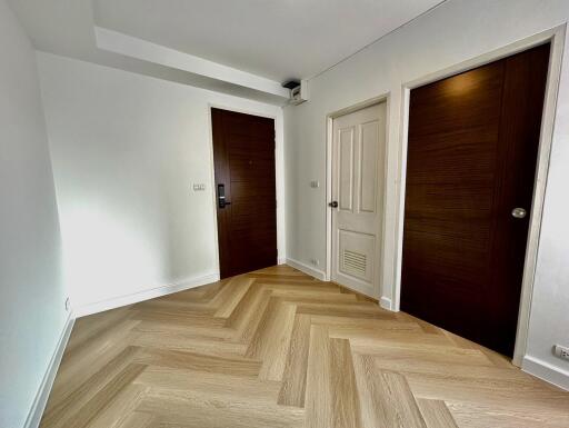 Interior view of a bedroom with wooden doors