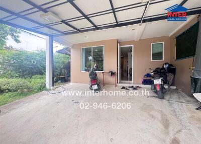 Outdoor parking space and partial view of the house