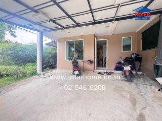 Outdoor parking space and partial view of the house