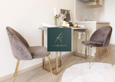 Modern kitchen dining area with velvet chairs and a small table