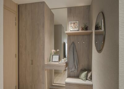 Cozy entryway with a built-in wooden closet and seating area