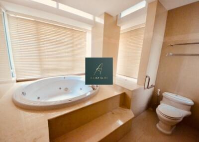 Bathroom with jacuzzi and toilet