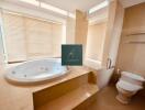 Bathroom with jacuzzi and toilet