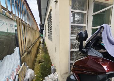 Outdoor area with motorbike near a building