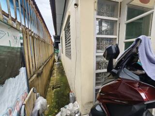 Outdoor area with motorbike near a building