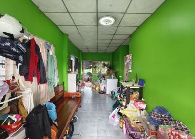 Multipurpose room with green walls and various items