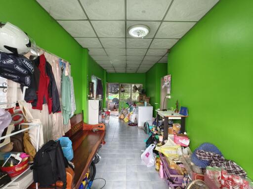 Multipurpose room with green walls and various items