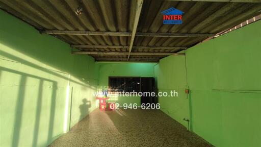 Covered garage area with tiled flooring