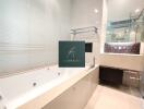 Modern bathroom with jacuzzi and large mirror