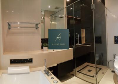 Modern bathroom with glass shower enclosure and bathtub