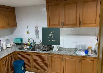 Kitchen with wooden cabinets and granite countertops