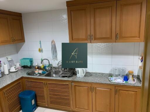 Kitchen with wooden cabinets and granite countertops