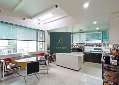 Modern kitchen with dining area and large windows