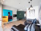 Modern living room with dark sectional sofa, colorful shelving, and pendant lights