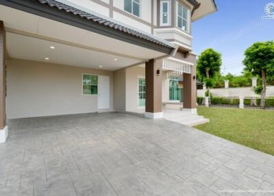 Exterior view of a modern two-story house with a spacious driveway