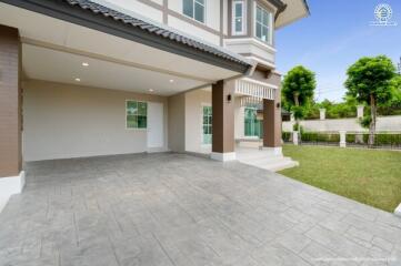 Exterior view of a modern two-story house with a spacious driveway