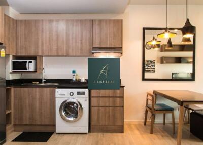 Modern kitchen with wooden cabinets and dining area