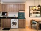 Modern kitchen with wooden cabinets and dining area