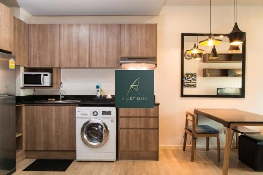 Modern kitchen with wooden cabinets and dining area