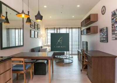 Modern living room with dining area and workspace