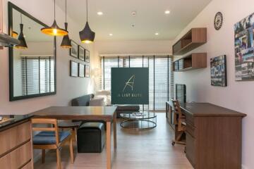 Modern living room with dining area and workspace