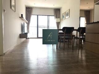 Spacious living room with dining area and balcony