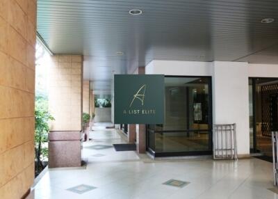 Lobby area of a building with a sign 