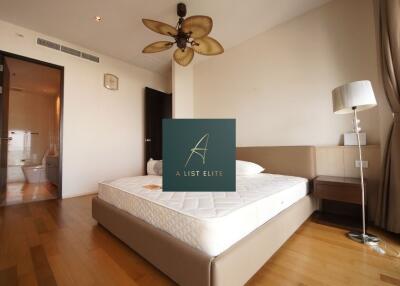 Spacious bedroom with large bed and ensuite bathroom