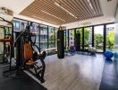 Modern gym with large windows and fitness equipment