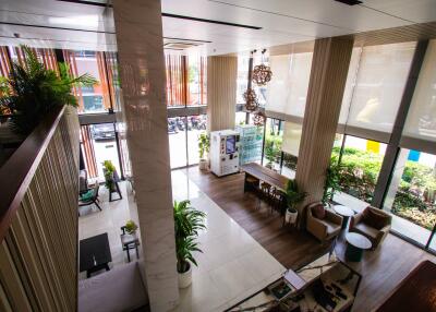 Modern lobby with seating area and large windows