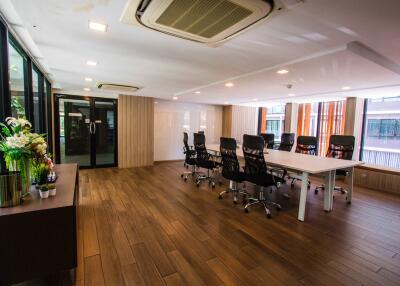 Modern conference room with large windows and stylish chairs