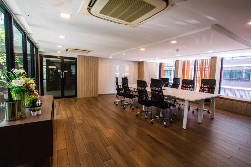 Modern conference room with large windows and stylish chairs