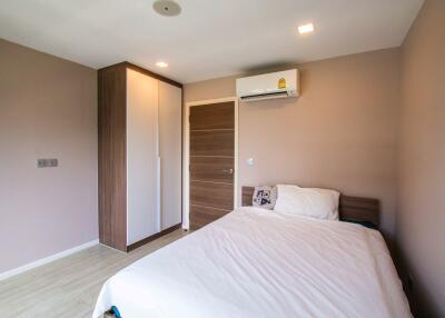 Modern bedroom with wardrobe and air conditioning