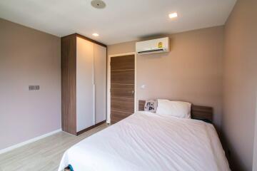 Modern bedroom with wardrobe and air conditioning