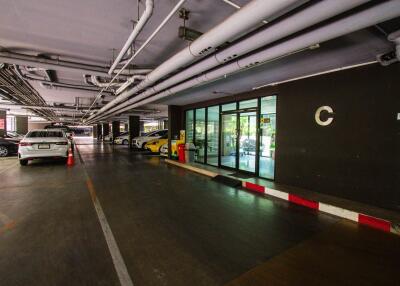 Indoor parking garage with multiple parking spaces and cars