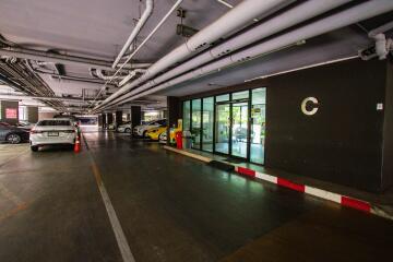 Indoor parking garage with multiple parking spaces and cars