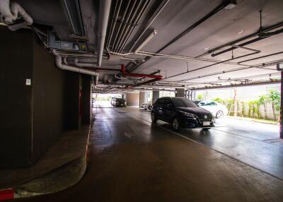 Underground parking space with several parked cars