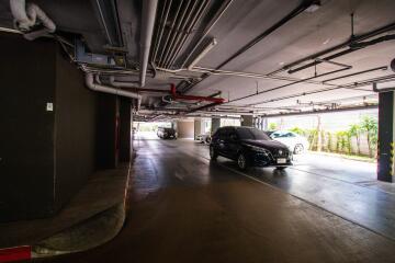 Underground parking space with several parked cars