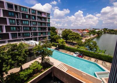 Modern apartment building with swimming pool and city views