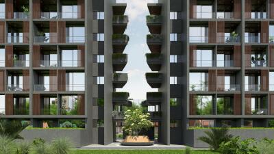 Modern apartment building exterior with balconies and greenery