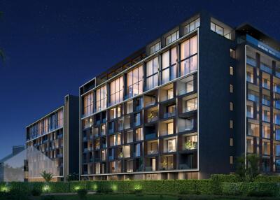 Exterior view of a modern apartment building at night