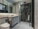 Modern bathroom with glass shower and marble tiles