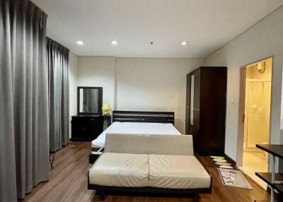 Spacious bedroom with modern furniture and en-suite bathroom