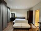 Spacious bedroom with modern furniture and en-suite bathroom