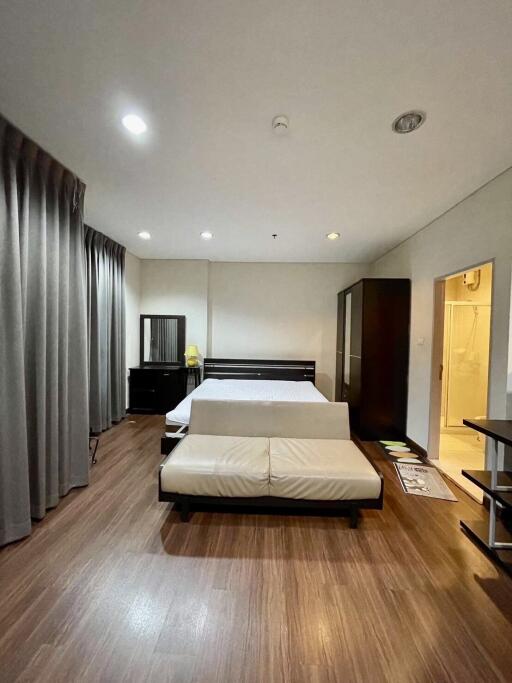 Spacious bedroom with modern furniture and en-suite bathroom