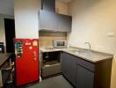 Modern kitchen with red refrigerator and appliances