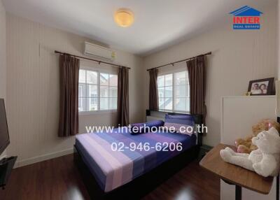 Bedroom with bed, window and air conditioner