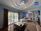 Cozy living room with chandelier and large windows