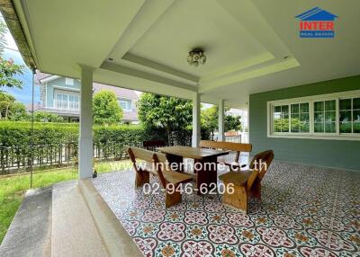 Outdoor patio with dining table and chairs